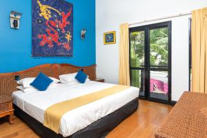 Postel nebo postele na pokoji v ubytování Dreamcatcher Beach-Side Apartments