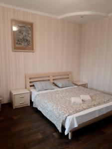Postel nebo postele na pokoji v ubytování Кімнати поруч з автовокзалом