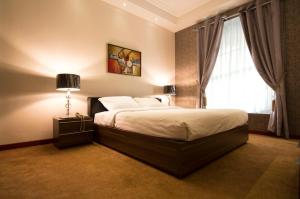 Postel nebo postele na pokoji v ubytování Le Park Hotel