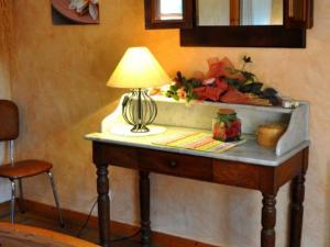 a table with a lamp on top of it at Gîte Maringes, 3 pièces, 5 personnes - FR-1-496-30 in Maringes