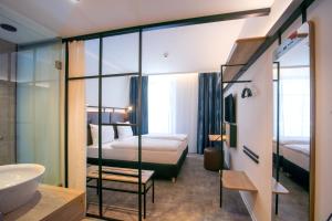 Posteľ alebo postele v izbe v ubytovaní H2 Hotel Budapest