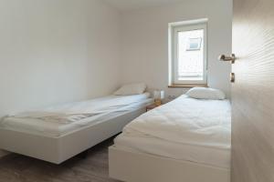 Ένα ή περισσότερα κρεβάτια σε δωμάτιο στο Julian Manor apartments