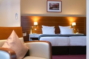 Postel nebo postele na pokoji v ubytování Hotel Kleiner Riesen
