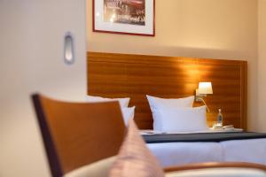 Postel nebo postele na pokoji v ubytování Hotel Kleiner Riesen