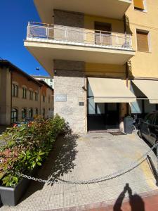 a person standing in front of a building at Fashionhouse in La Spezia