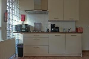 Η κουζίνα ή μικρή κουζίνα στο Slaap Lekker +22 φωτογραφίες