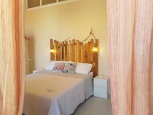A bed or beds in a room at BALCONI SU TROPEA