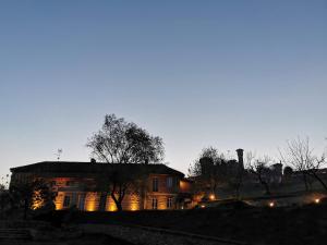 a house at night with lights on at Agriturismo Airale in Cereseto