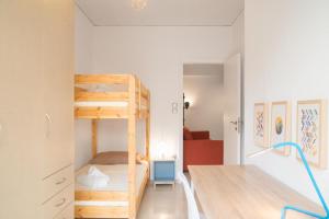 a small room with a bunk bed and a bedroom at Cozy Apartment in Central Athens - Sleeps 5 in Athens