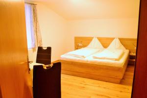 Postel nebo postele na pokoji v ubytování Haus Waldheim