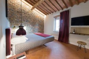 Postel nebo postele na pokoji v ubytování Monna Caterina Wine Resort