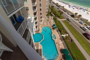 an aerial view of a swimming pool in front of the beach at Majestic Sun by Seascape Resort in Destin