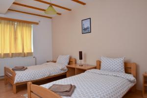 Postel nebo postele na pokoji v ubytování Sobe Zlatnik + 5 fotografií