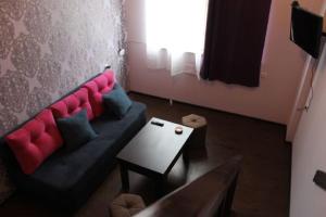 a living room with a couch and a table at Sevan Hotel in Sevan