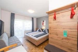 Postel nebo postele na pokoji v ubytování Gästehaus Genf