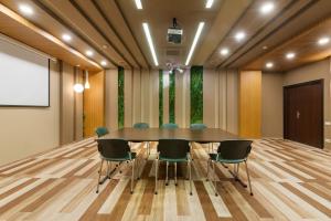 a conference room with a table and chairs at Business Hotel Diplomat in Nizhny Novgorod