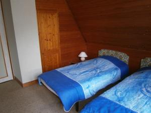 En eller flere senge i et værelse på Gîte Authon-du-Perche, 3 pièces, 5 personnes - FR-1-581-1