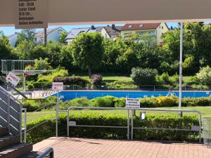 a park with a garden with bushes and signs at Apartment-47 Fulda in Fulda