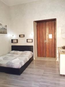 Posteľ alebo postele v izbe v ubytovaní Napoli central