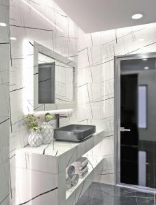 A kitchen or kitchenette at Rua Mat - Serene Villas with Modern Comfort, by ZanteWize
