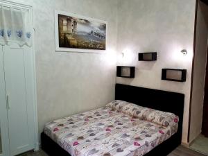 Posteľ alebo postele v izbe v ubytovaní Napoli central