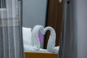 a towel in the shape of a heart in a mirror at Moza House in Kavala