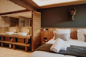 Voodi või voodid majutusasutuse Lodji Hotel & spa toas