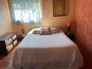 Postel nebo postele na pokoji v ubytování Casa di Floumy