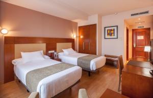 Postel nebo postele na pokoji v ubytování Hotel Andia