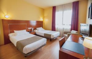 TV a/nebo společenská místnost v ubytování Hotel Andia