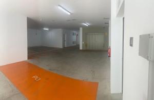 an empty room with an orange floor and white walls at Royal Flats in Las Palmas de Gran Canaria