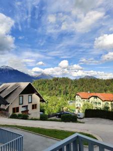 a view of a house with mountains in the background at Villa Recica North in Bled