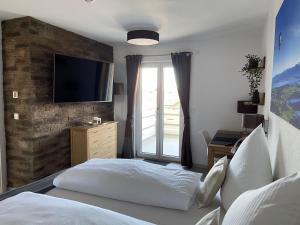 Postel nebo postele na pokoji v ubytování Haus Langweid - Moderne Ferienwohnungen mit Luxus im Inntal