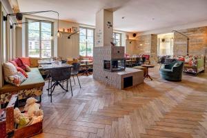 a living room filled with furniture and a fireplace at Hotel Restaurant Seehof in Küssnacht