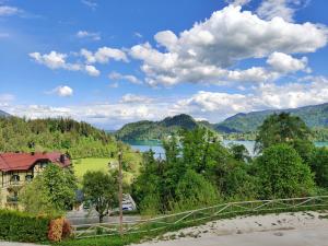 a view of a lake and a house at Villa Recica North in Bled