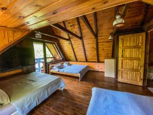 Llit o llits en una habitació de Kashubia Cottage
