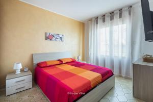 A bed or beds in a room at House&Villas - Mare Blu
