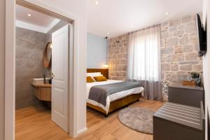 Posteľ alebo postele v izbe v ubytovaní Luxury rooms Spalatum