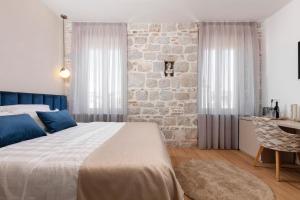 Posteľ alebo postele v izbe v ubytovaní Luxury rooms Spalatum