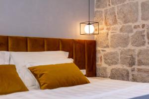 Posteľ alebo postele v izbe v ubytovaní Luxury rooms Spalatum