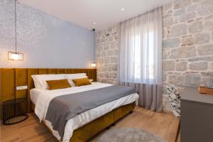 Posteľ alebo postele v izbe v ubytovaní Luxury rooms Spalatum