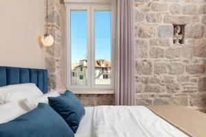 Posteľ alebo postele v izbe v ubytovaní Luxury rooms Spalatum