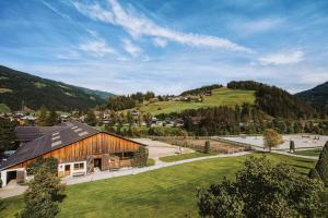 an aerial view of a barn in the mountains at Gut Weissenhof in Radstadt