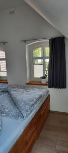 Ein Bett oder Betten in einem Zimmer der Unterkunft Ferienhof Kleemann
