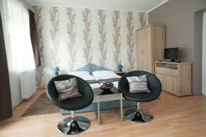 Televízia a/alebo spoločenská miestnosť v ubytovaní Oleander Apartman