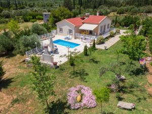 an aerial view of a house with a swimming pool at Country Style Villa Christina in Pouláta