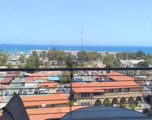 a view of a city from a balcony at T&E Apartment in Larnaka