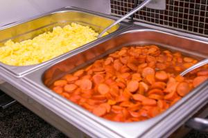a tray of carrots and cauliflower and other vegetables at Gv Park Hotel in Governador Valadares