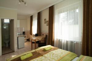 Kuchyňa alebo kuchynka v ubytovaní Oleander Apartman
