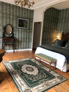 Łóżko lub łóżka w pokoju w obiekcie Chambres d'hôtes du château